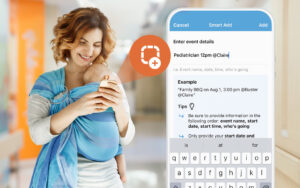mom holding baby using phone to make doctor's appointment