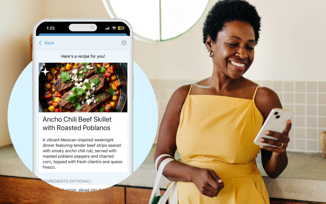 Woman in a yellow dress looking at Cozi Max meal planner feature on her mobile phone.